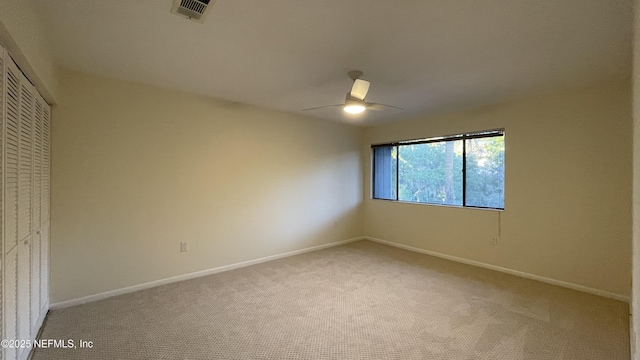 2664 SW 14th Dr Unit 325, Gainesville, FL 32608 - unfurnished bedroom featuring carpet, a closet, and a ceiling fan