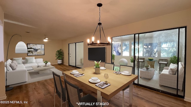 2664 SW 14th Dr Unit 325, Gainesville, FL 32608 - dining room featuring wood finished floors and a chandelier