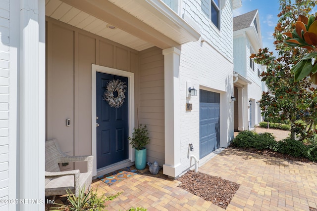 30 Yeti Ct, Saint Augustine, FL 32092 - property entrance with a garage, board and batten siding, and a shingled roof