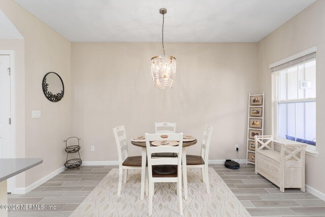 30 Yeti Ct, Saint Augustine, FL 32092 - dining area featuring wood tiled floors and a chandelier