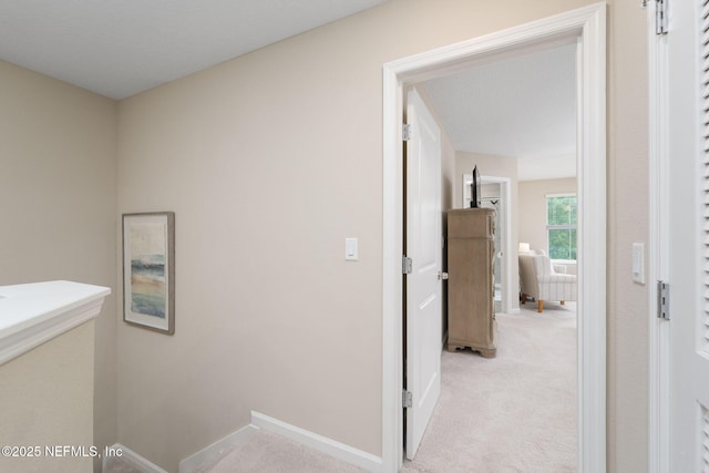30 Yeti Ct, Saint Augustine, FL 32092 - hallway featuring light colored carpet and an upstairs landing