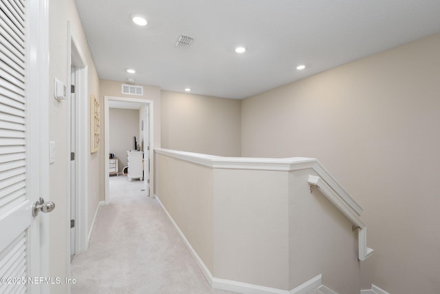 30 Yeti Ct, Saint Augustine, FL 32092 - hallway with an upstairs landing, light colored carpet, and recessed lighting