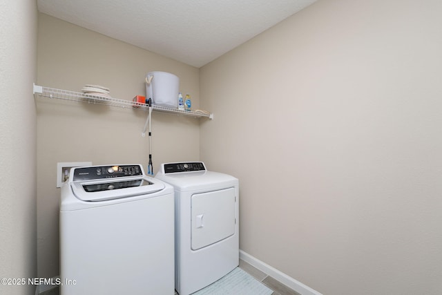 30 Yeti Ct, Saint Augustine, FL 32092 - laundry area featuring washer and clothes dryer and baseboards