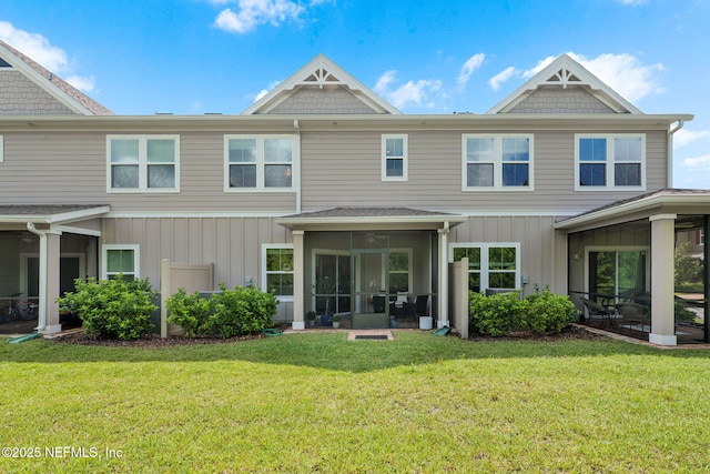 30 Yeti Ct, Saint Augustine, FL 32092 - rear view of property featuring a sunroom, a yard, and board and batten siding