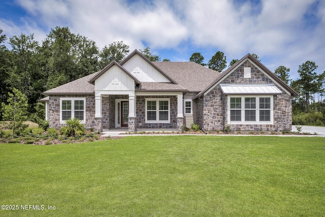 36250 Pitch Ln, Hilliard, FL 32046 - craftsman house with stone siding, a front yard, board and batten siding, and roof with shingles