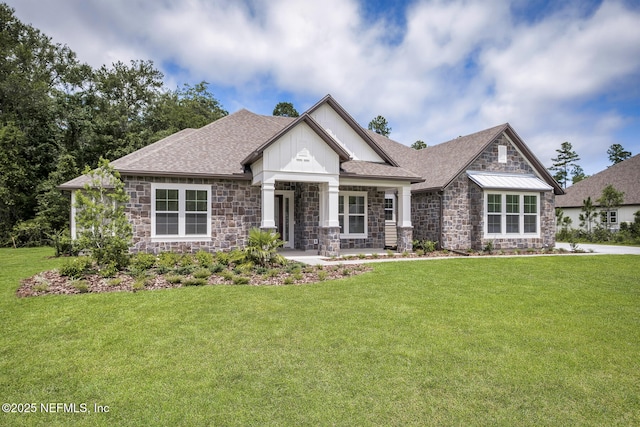 36250 Pitch Ln, Hilliard, FL 32046 - craftsman-style home featuring stone siding, a front lawn, and a shingled roof