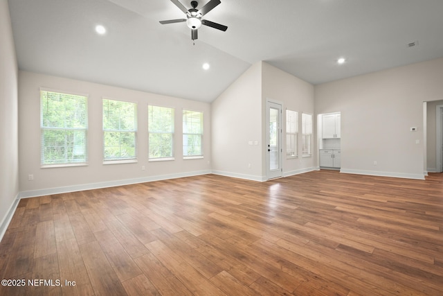 36250 Pitch Ln, Hilliard, FL 32046 - unfurnished living room with lofted ceiling, ceiling fan, wood finished floors, and recessed lighting
