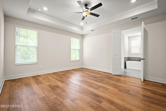 36250 Pitch Ln, Hilliard, FL 32046 - unfurnished bedroom with a raised ceiling, ornamental molding, wood-type flooring, recessed lighting, and a ceiling fan