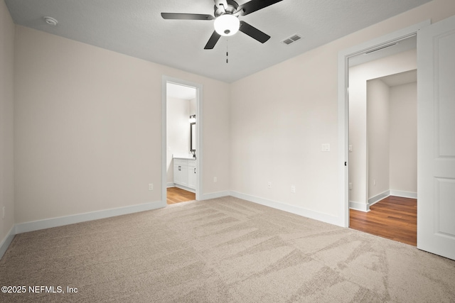 36250 Pitch Ln, Hilliard, FL 32046 - unfurnished bedroom with carpet flooring, ensuite bath, and ceiling fan