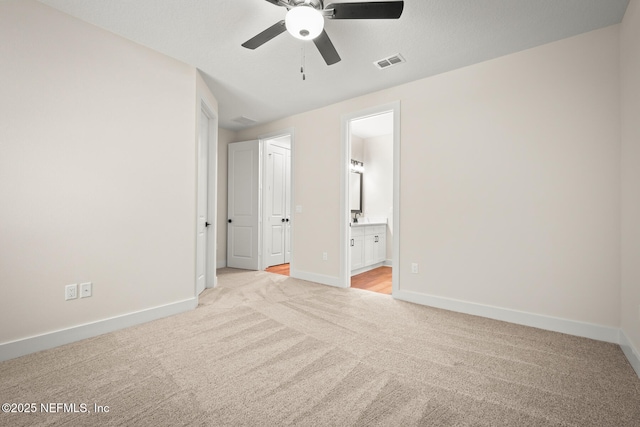36250 Pitch Ln, Hilliard, FL 32046 - unfurnished bedroom featuring light carpet, ensuite bathroom, and ceiling fan