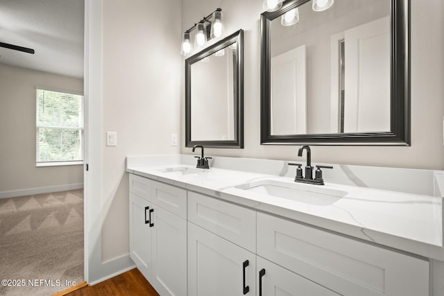 36250 Pitch Ln, Hilliard, FL 32046 - bathroom with double vanity and baseboards