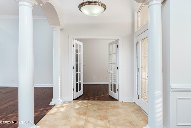 1700 Southcreek Dr, Saint Johns, FL 32259 - foyer with ornate columns, french doors, ornamental molding, and arched walkways