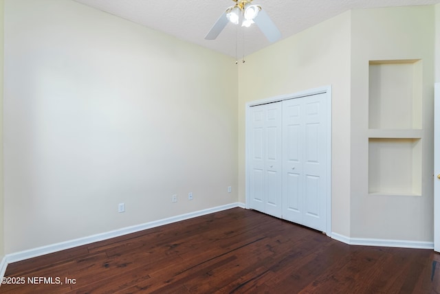 1700 Southcreek Dr, Saint Johns, FL 32259 - unfurnished bedroom with dark wood-type flooring, a closet, a textured ceiling, and ceiling fan
