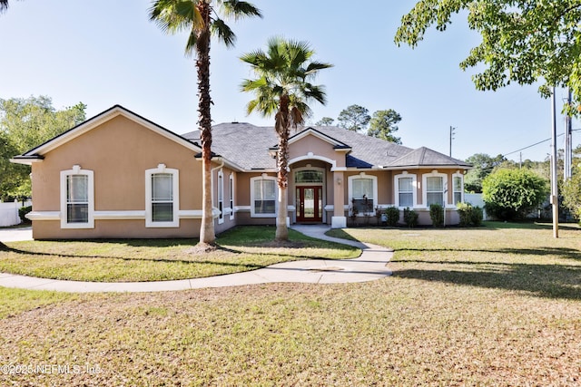 1700 Southcreek Dr, Saint Johns, FL 32259 - view of front of property with stucco siding and a front yard