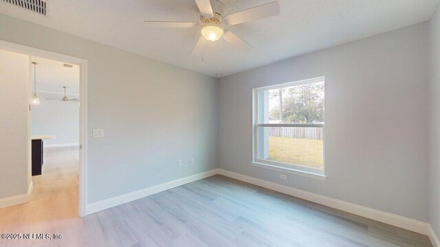 99 Sloganeer Trl, Palm Coast, FL 32164 - empty room with wood finished floors and ceiling fan