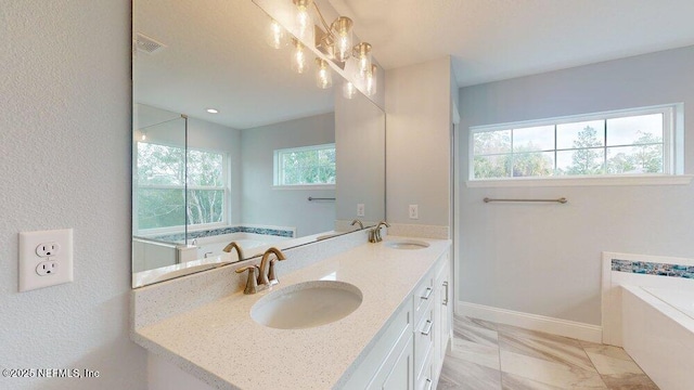 99 Sloganeer Trl, Palm Coast, FL 32164 - full bath with double vanity, a garden tub, and marble finish flooring