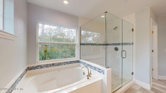 99 Sloganeer Trl, Palm Coast, FL 32164 - full bath with a bath, plenty of natural light, a shower stall, and recessed lighting