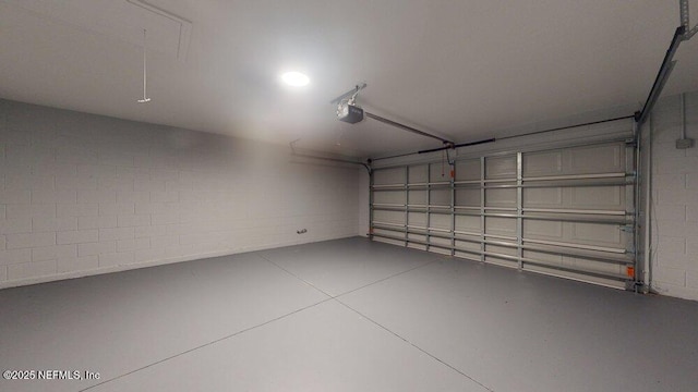 99 Sloganeer Trl, Palm Coast, FL 32164 - garage with a garage door opener and concrete block wall
