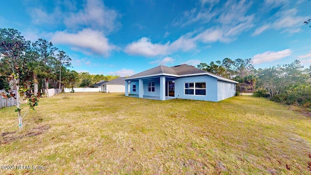 99 Sloganeer Trl, Palm Coast, FL 32164 - back of property featuring stucco siding