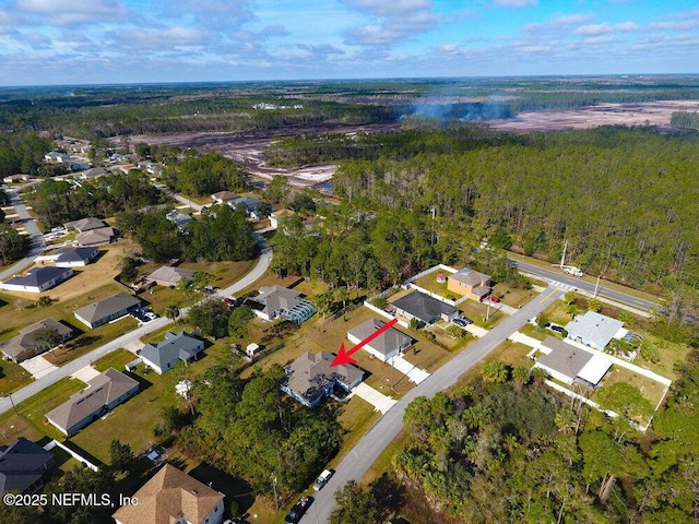 99 Sloganeer Trl, Palm Coast, FL 32164 - aerial view of property and surrounding area with a heavily wooded area and nearby suburban area