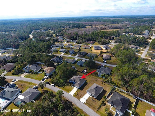 99 Sloganeer Trl, Palm Coast, FL 32164 - aerial view of property's location featuring a forest and nearby suburban area