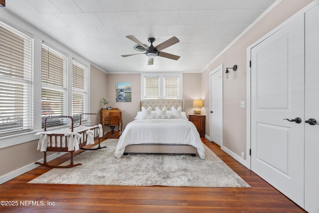 117 Parshley St SW, Live Oak, FL 32064 - bedroom with ornamental molding, wood finished floors, and a ceiling fan