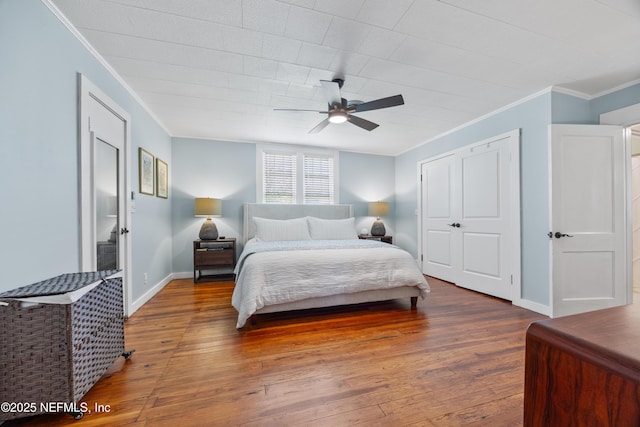 117 Parshley St SW, Live Oak, FL 32064 - bedroom with crown molding, hardwood / wood-style flooring, a ceiling fan, and a closet