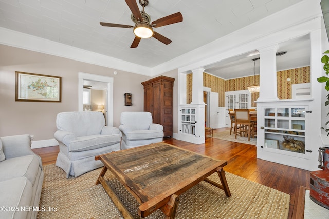 117 Parshley St SW, Live Oak, FL 32064 - living area with ornate columns, hardwood / wood-style floors, ceiling fan, ornamental molding, and wallpapered walls