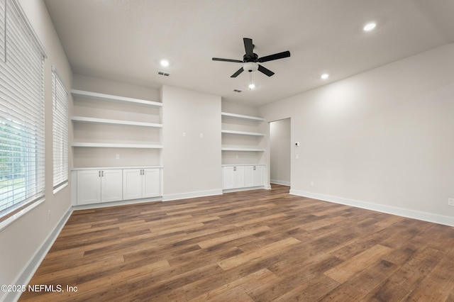 36258 Pitch Ln, Hilliard, FL 32046 - unfurnished living room featuring ceiling fan, recessed lighting, wood finished floors, and built in features