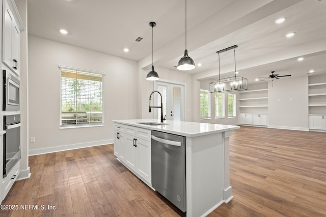 36258 Pitch Ln, Hilliard, FL 32046 - kitchen featuring stainless steel appliances, recessed lighting, white cabinetry, light wood-style floors, and light countertops
