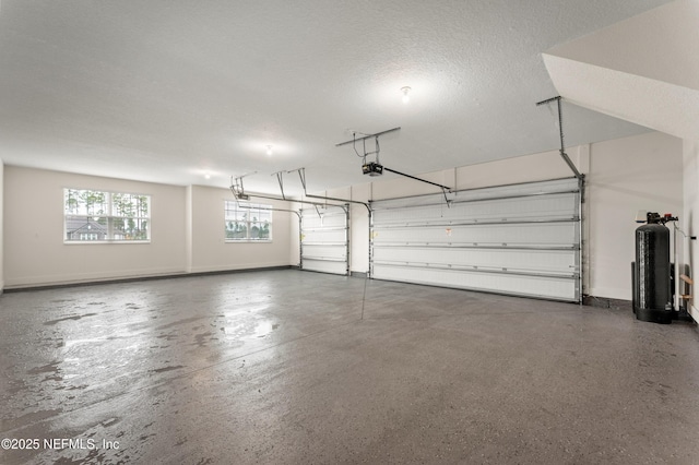 36258 Pitch Ln, Hilliard, FL 32046 - garage featuring a garage door opener and baseboards