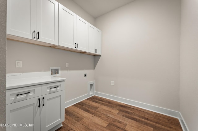 36258 Pitch Ln, Hilliard, FL 32046 - laundry area with cabinet space, electric dryer hookup, dark wood finished floors, and washer hookup