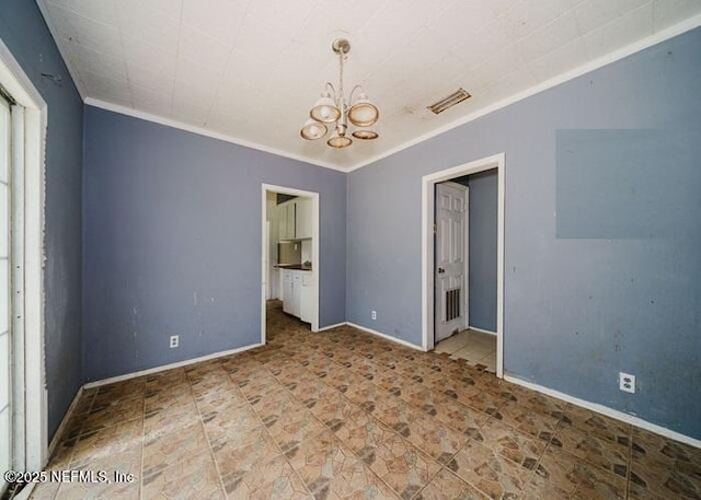14344 68th St, Live Oak, FL 32060 - empty room featuring a chandelier and crown molding