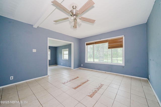14344 68th St, Live Oak, FL 32060 - empty room featuring a ceiling fan, light tile patterned floors, and beamed ceiling