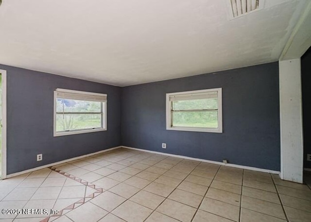 14344 68th St, Live Oak, FL 32060 - spare room featuring healthy amount of natural light and light tile patterned flooring