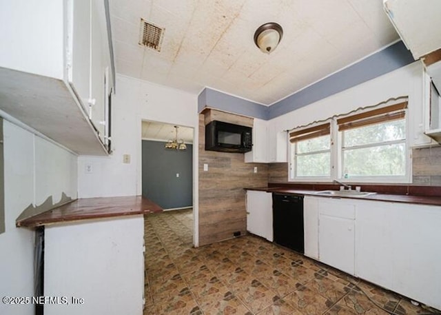 14344 68th St, Live Oak, FL 32060 - kitchen featuring black appliances, backsplash, white cabinetry, dark countertops, and a chandelier