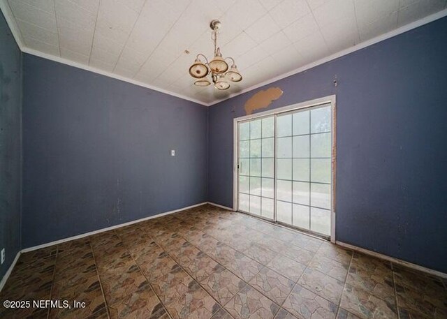 14344 68th St, Live Oak, FL 32060 - spare room with crown molding and a chandelier