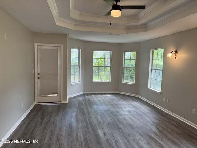 1032 Durbin Parke Dr, Jacksonville, FL 32259 - spare room with a raised ceiling, ornamental molding, healthy amount of natural light, dark wood-type flooring, and a ceiling fan