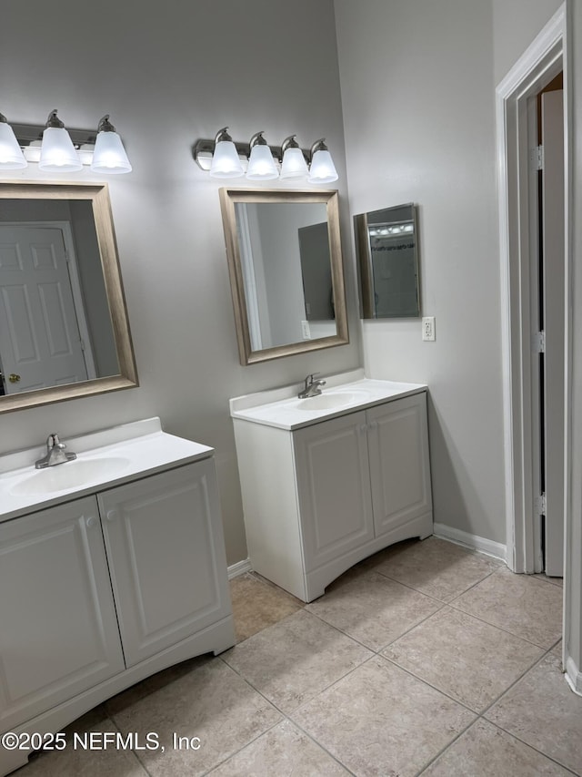 1032 Durbin Parke Dr, Jacksonville, FL 32259 - bathroom featuring two vanities and tile patterned flooring