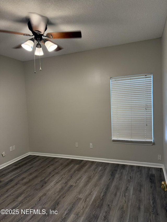 1032 Durbin Parke Dr, Jacksonville, FL 32259 - empty room with dark wood-style flooring, a ceiling fan, and a textured ceiling
