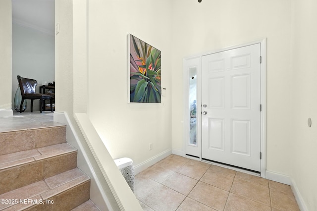 2201 Windjammer Ln, Saint Augustine, FL 32084 - tiled foyer entrance featuring ornamental molding and baseboards