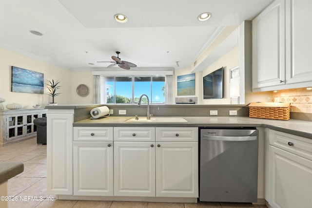 2201 Windjammer Ln, Saint Augustine, FL 32084 - kitchen featuring stainless steel dishwasher, ornamental molding, backsplash, ceiling fan, and white cabinetry