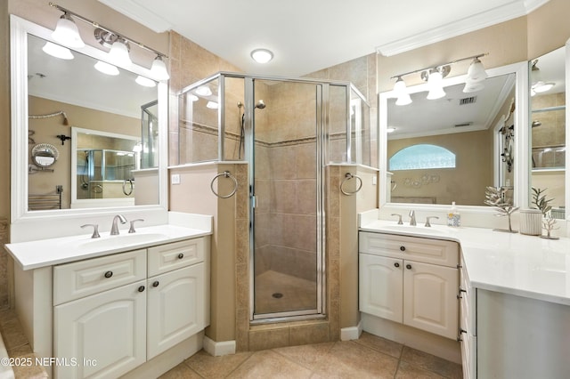 2201 Windjammer Ln, Saint Augustine, FL 32084 - full bathroom featuring crown molding, two vanities, a shower stall, and tile patterned flooring