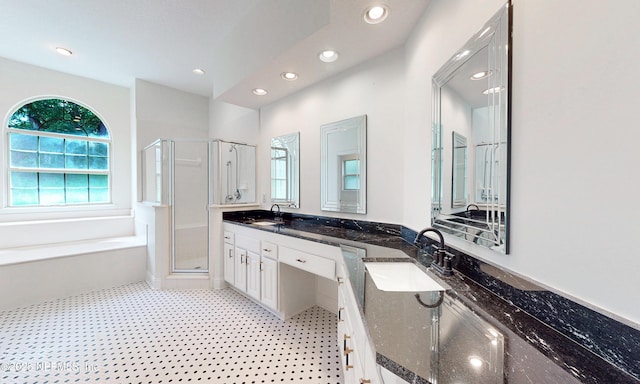 1877 Medinah Ln, Green Cove Springs, FL 32043 - bathroom with a stall shower, double vanity, a garden tub, and recessed lighting