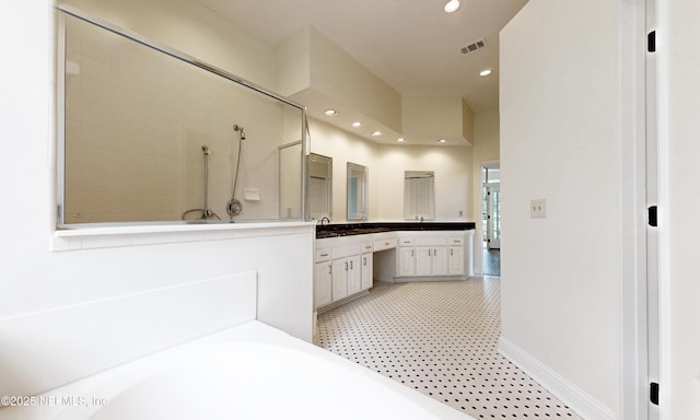 1877 Medinah Ln, Green Cove Springs, FL 32043 - full bathroom featuring vanity, recessed lighting, a garden tub, and a tile shower
