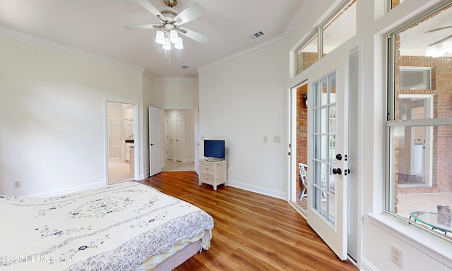 1877 Medinah Ln, Green Cove Springs, FL 32043 - bedroom featuring wood finished floors, crown molding, ensuite bath, and a ceiling fan