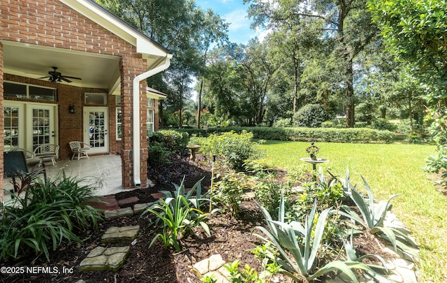 1877 Medinah Ln, Green Cove Springs, FL 32043 - view of grassy yard featuring a ceiling fan and a patio