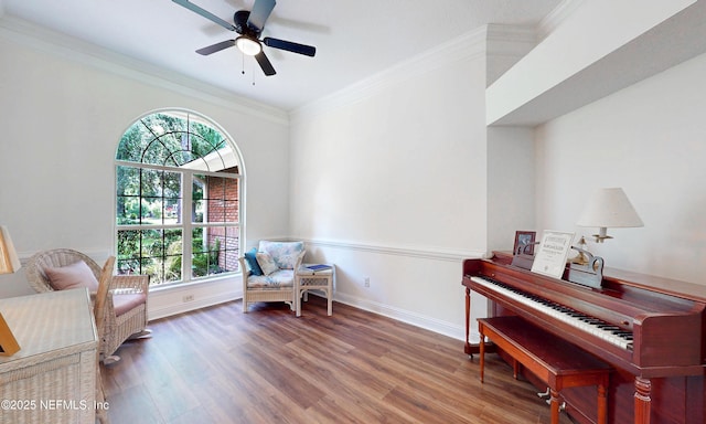 1877 Medinah Ln, Green Cove Springs, FL 32043 - sitting room featuring healthy amount of natural light, wood finished floors, crown molding, and a ceiling fan