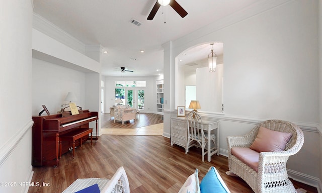 1877 Medinah Ln, Green Cove Springs, FL 32043 - living area featuring a ceiling fan, wood finished floors, crown molding, arched walkways, and recessed lighting
