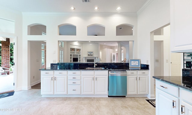 1877 Medinah Ln, Green Cove Springs, FL 32043 - kitchen featuring dishwasher, dark stone counters, crown molding, white cabinetry, and a towering ceiling